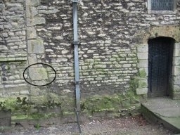 View of bench mark on wall near Tower Door