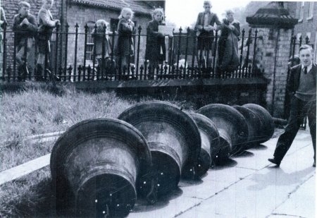 Bells on path outside church